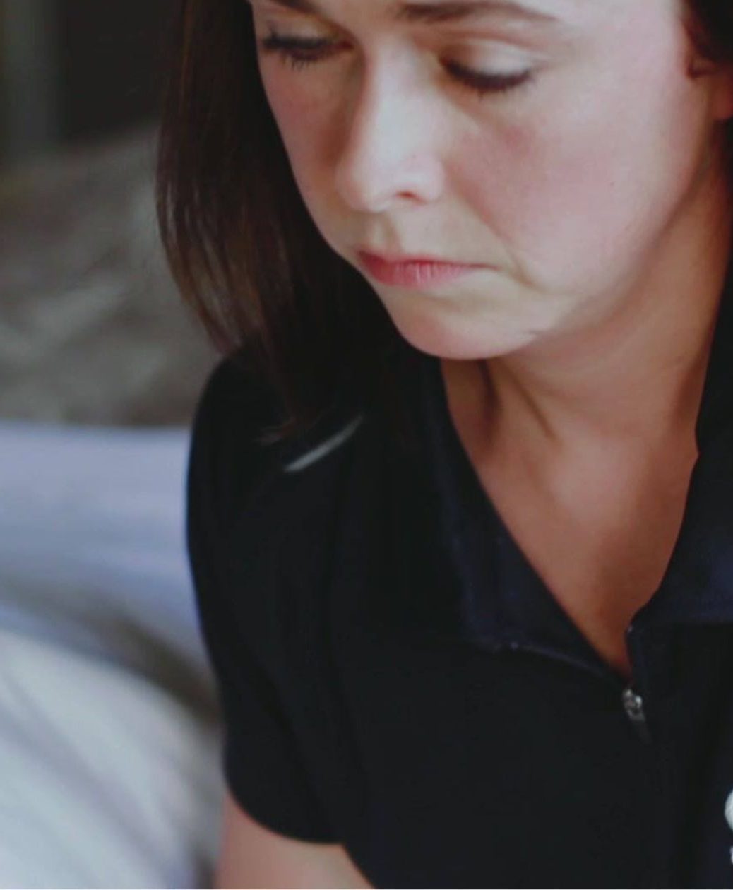 a woman wearing a black shirt giving a deep tissue massage